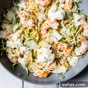A bowl of food on a plate, with Pasta and Garlic