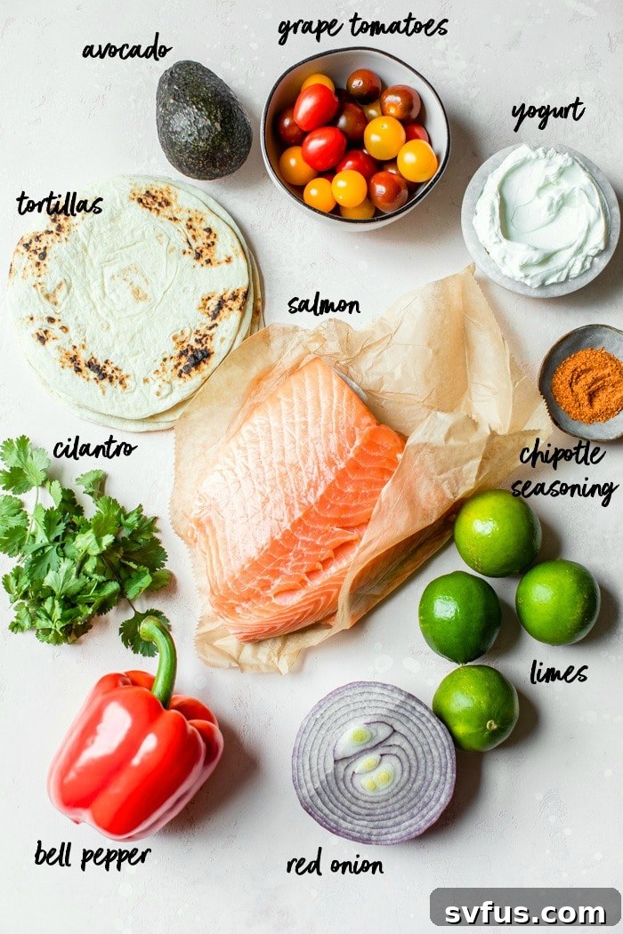 ingredients to make salmon fajitas with text overlay, including salmon fillets, limes, cajun seasoning, grape tomatoes, bell peppers, red onion, avocado, flour tortillas, and a bowl of yogurt, lime juice, and cilantro for the sauce