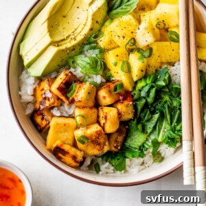 bowl with white rice, tofu, pineapple, and avocado