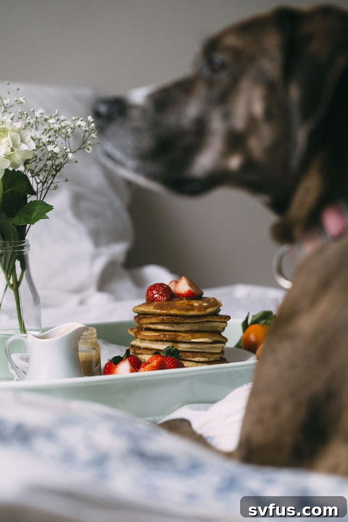 Stack of freshly made Cinnamon Tahini Pancakes, glistening with cinnamon tahini maple syrup