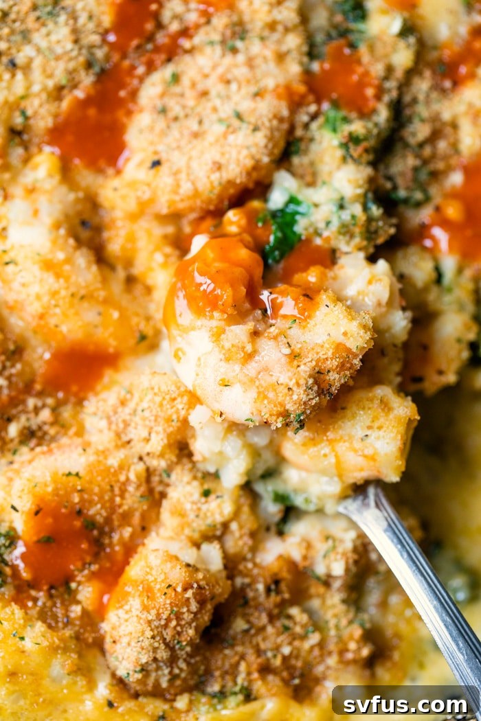 A close-up view of the golden-brown breadcrumb topping on the Cheesy Cauliflower Rice Skillet, showing off the perfectly baked texture.