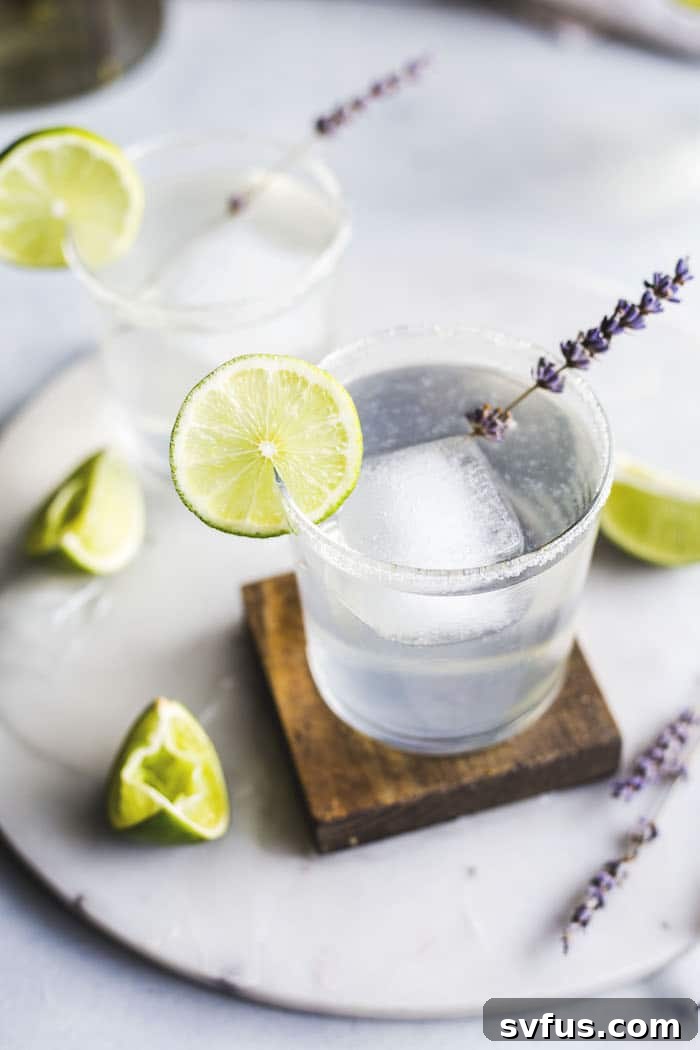Close-up of a Lavender Margarita garnished with fresh lavender sprigs
