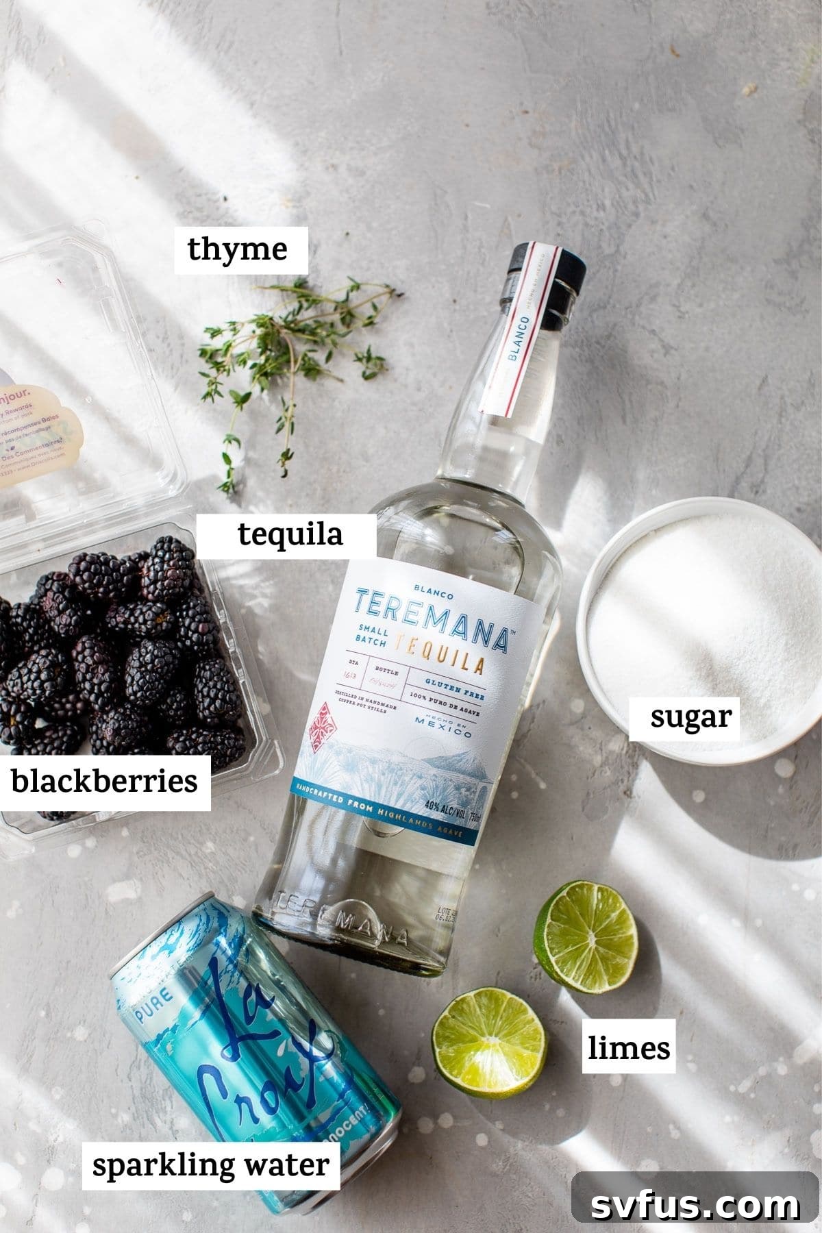 ingredients to make a cocktail with text overlay, including blackberries, limes, thyme, and tequila