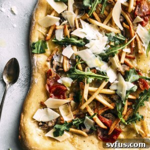 White Truffle Pizza made with truffle oil and topped with FRENCH FRIES!