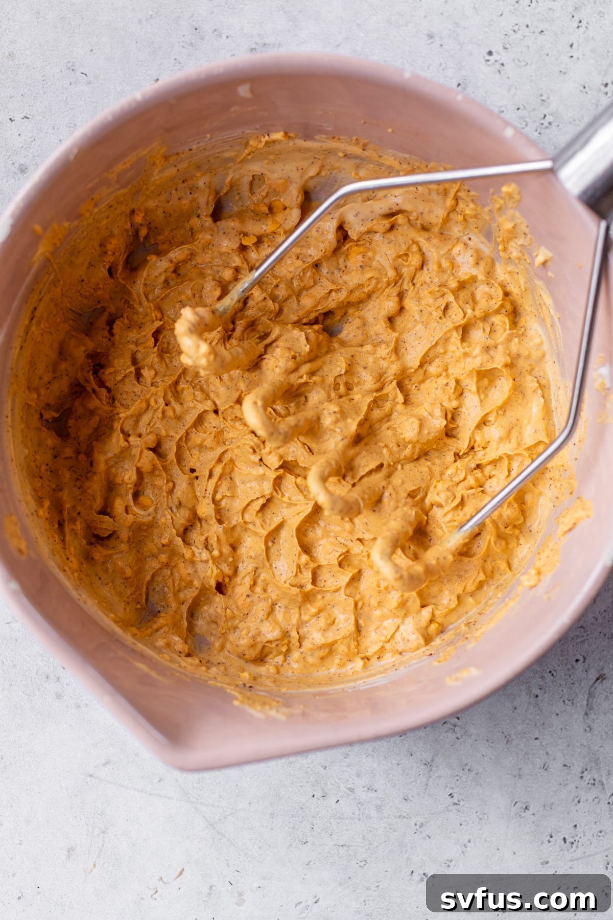 Creamy chipotle deviled egg filling mashed in a large bowl