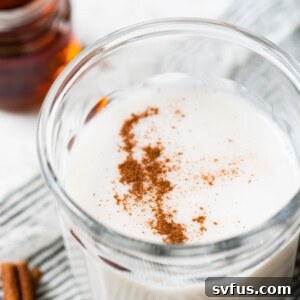 glass of milk topped with cinnamon
