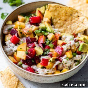 stone fruit ceviche in a bowl with tortilla chip