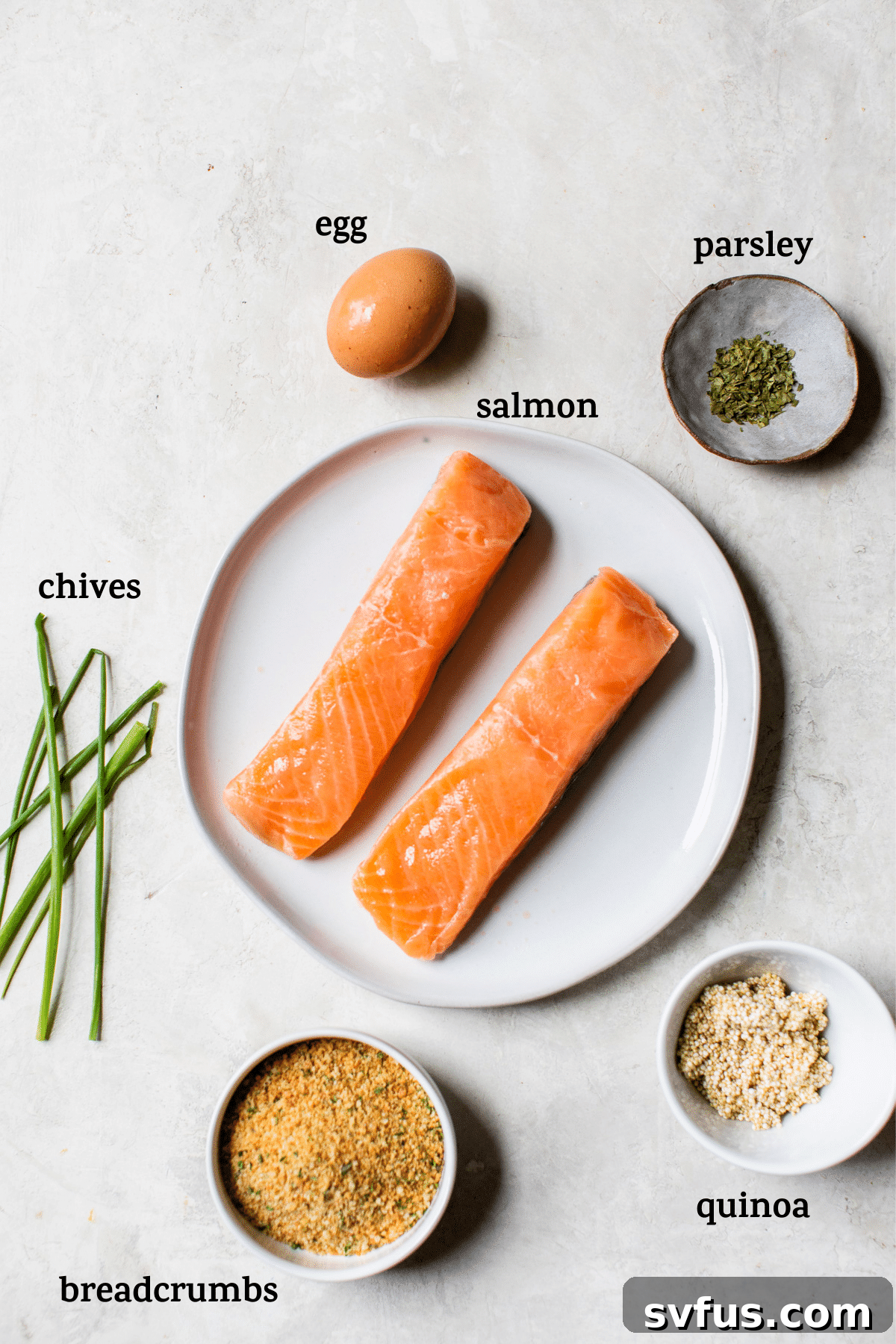 A close-up shot of a plate showcasing a perfectly cooked Quinoa Crusted Salmon fillet, highlighting its golden, textured crust.