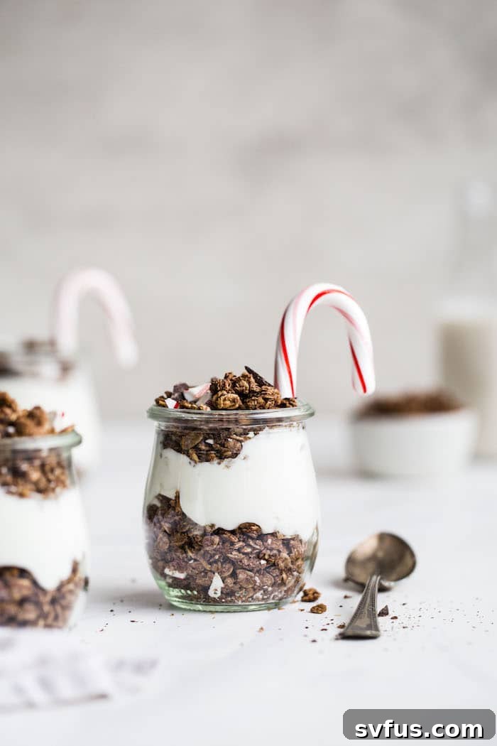 Individual serving of chocolate peppermint granola parfait with layered yogurt