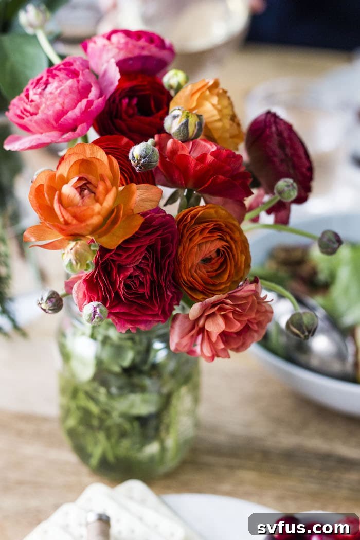 Close-up of a festive holiday drink, likely wine, on a beautifully set table.