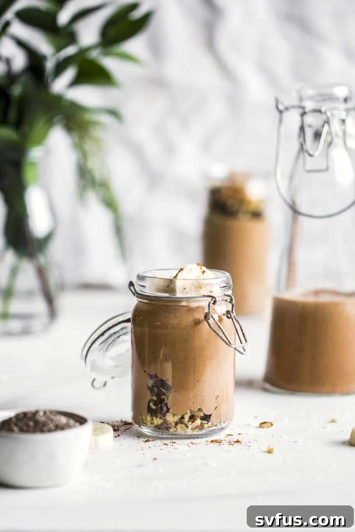 Close-up of a refreshing chocolate walnut smoothie in a glass jar, perfect for a healthy start to the day