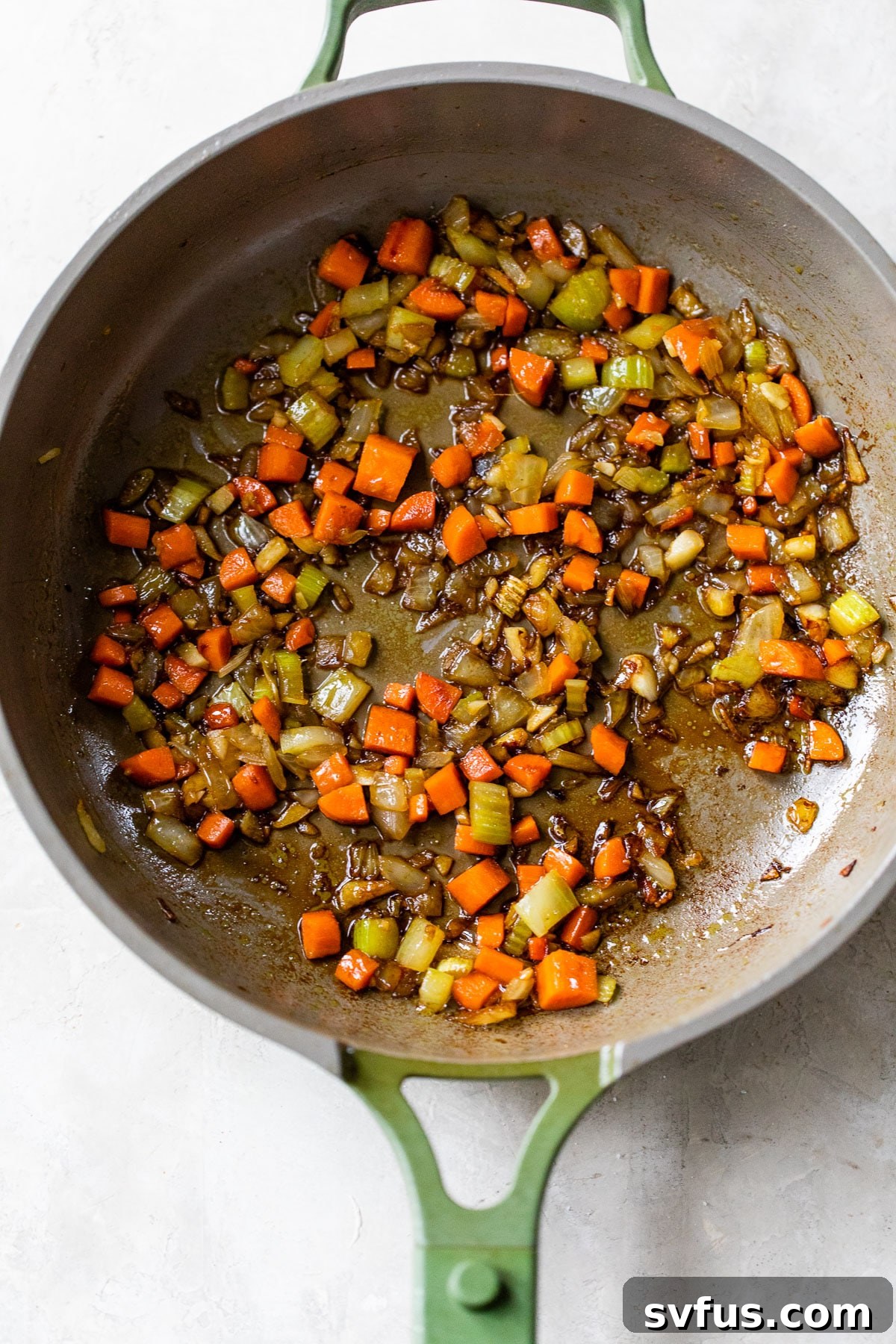 Sautéed carrot, celery, onion, and garlic in a large skillet, ready for the meatloaf mixture.