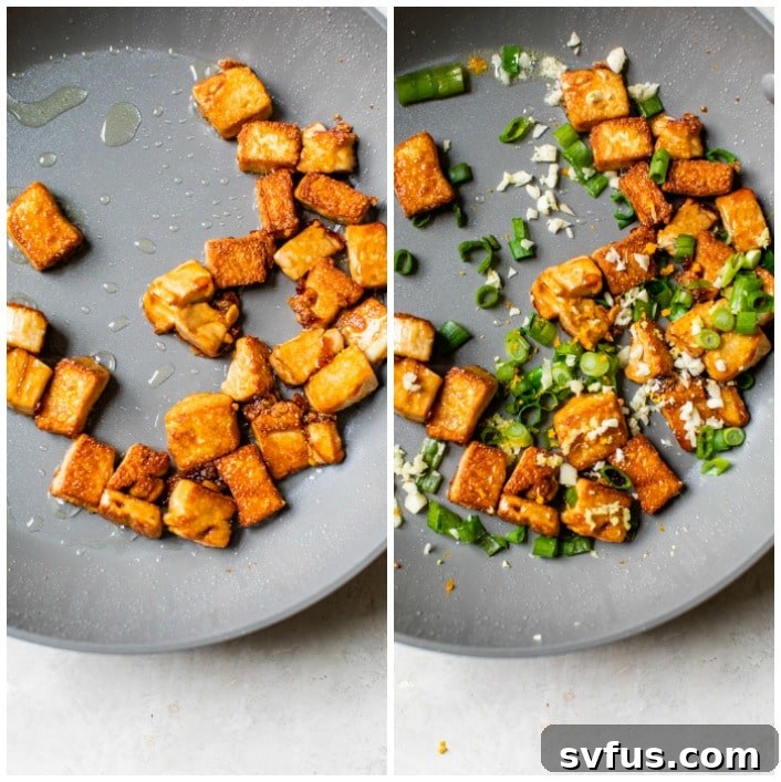 Pan-fried tofu in a skillet with chopped scallions, orange zest, garlic, and ginger sautéing