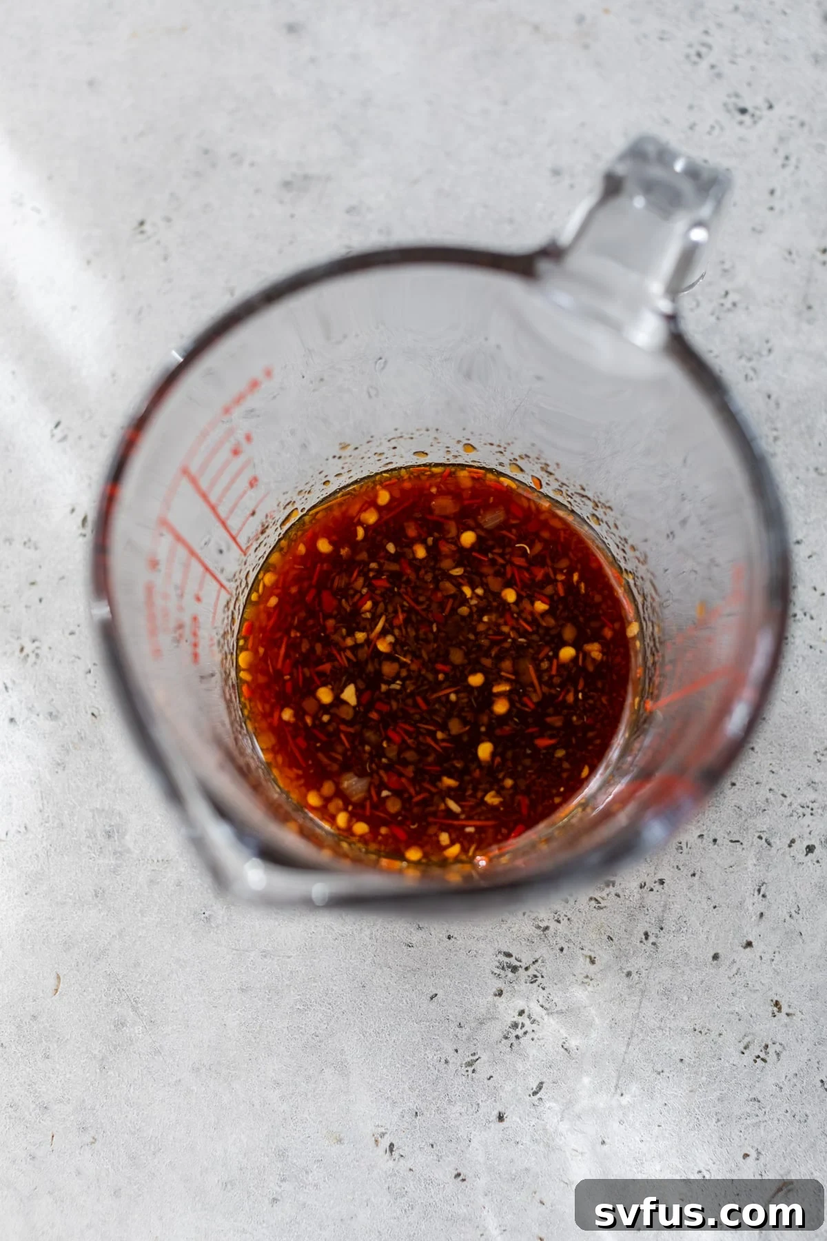 All sauce ingredients in a measuring glass, perfectly mixed and ready to use.