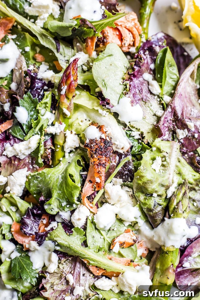 Another perspective of the Garlic Salmon Salad, highlighting the crisp asparagus and creamy tzatziki.