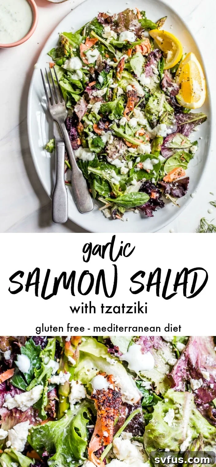 A large serving platter of the finished Garlic Salmon Salad, showcasing the arrangement of salmon, asparagus, and greens, with tzatziki sauce.