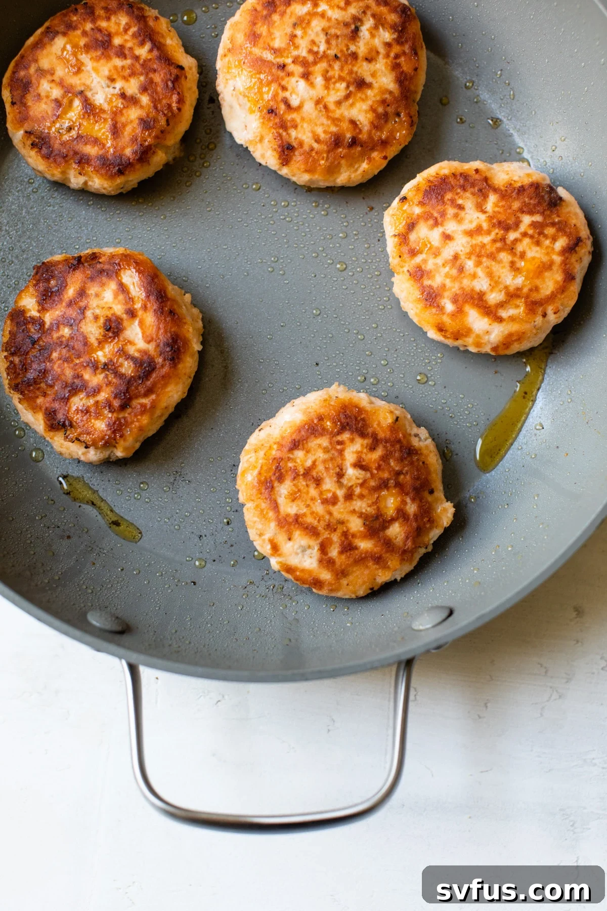 A pan of Salmon burgers