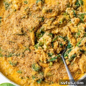 mac and cheese with quinoa and spinach in a skillet