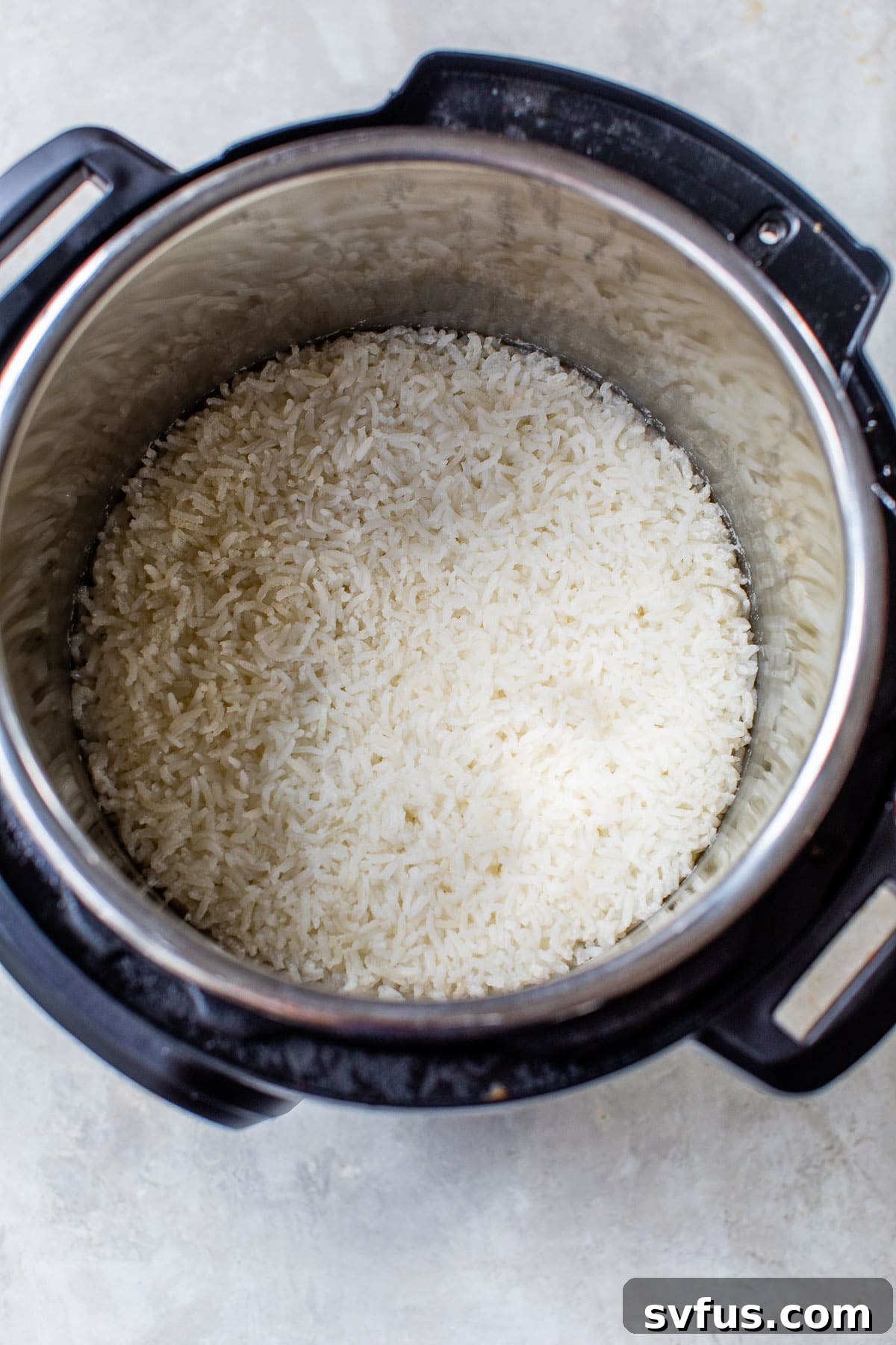 Perfectly cooked white rice in an Instant Pot after pressure cooking, ready to be chilled.