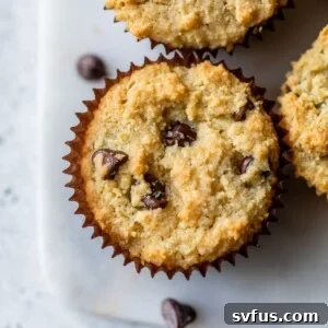 chocolate chip muffins on a marble cutting board