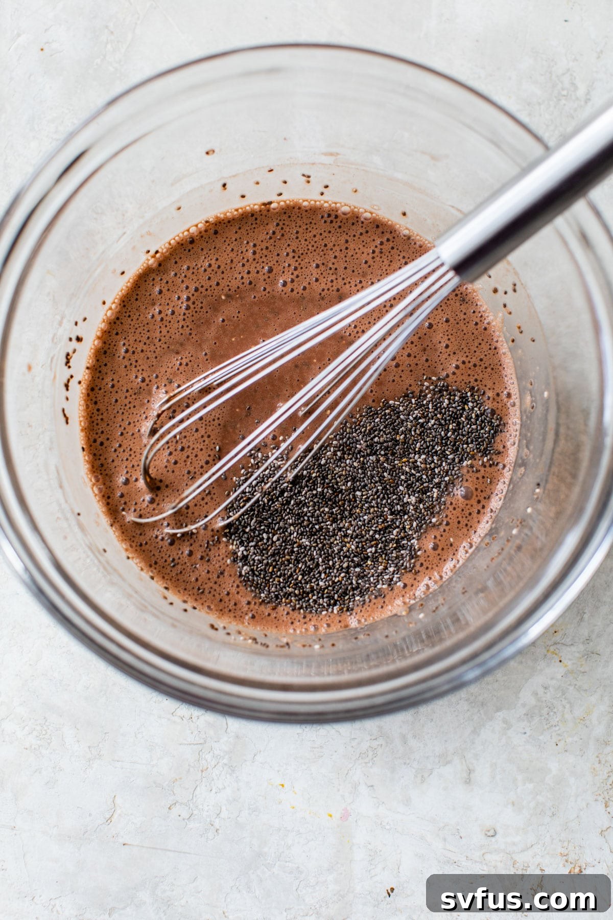 glass bowl with chocolate milk and chia seeds