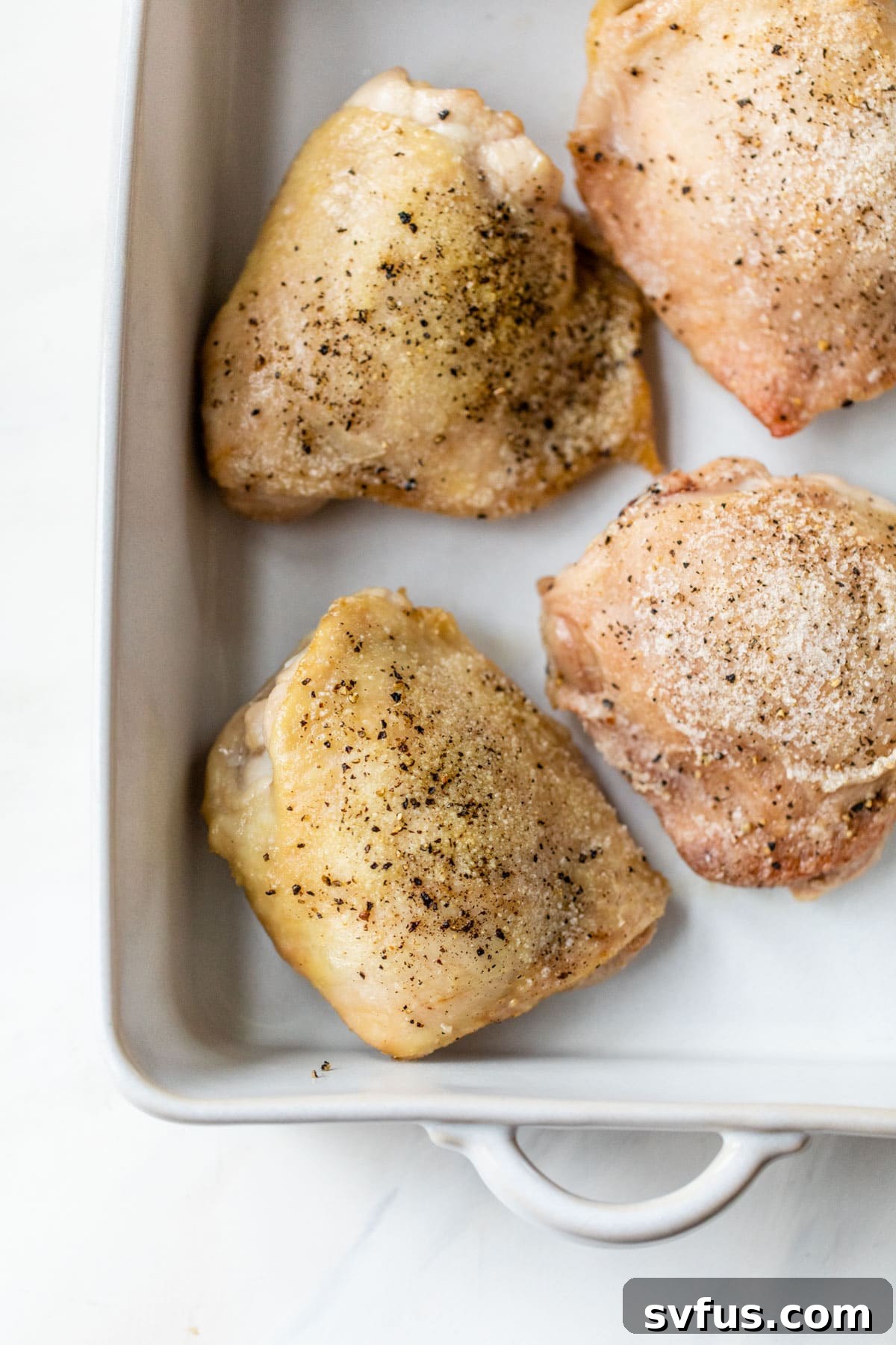crispy chicken thighs seasoned with salt and pepper