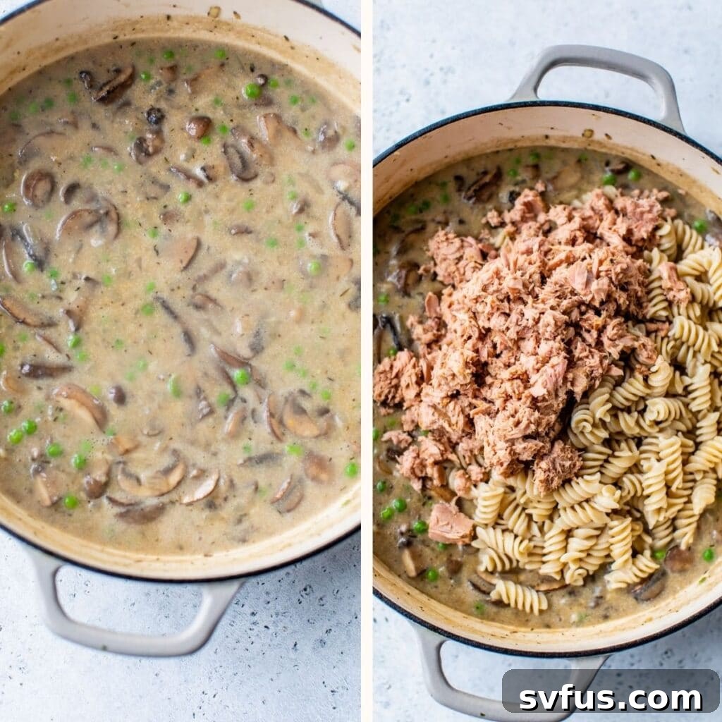 Round casserole dish filled with a creamy mixture of mushrooms, peas, tuna, and pasta, ready for the topping