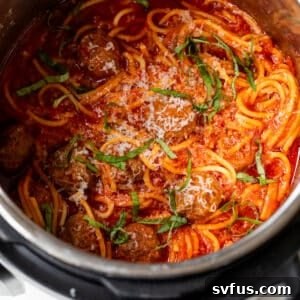 Overhead view of spaghetti and meatballs in an instant pot, serving as a recipe thumbnail.