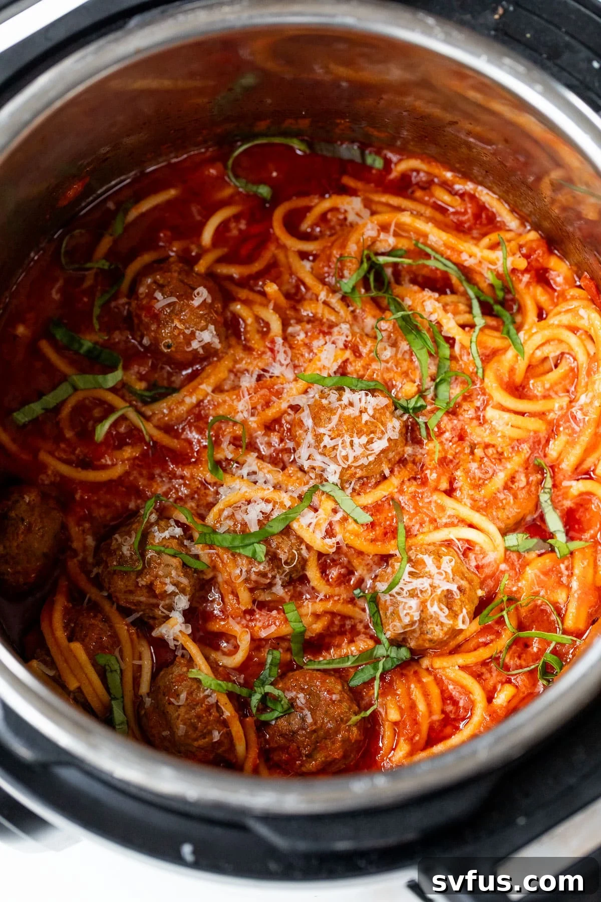 Overhead shot of Instant Pot spaghetti and meatballs in the pot, ready for serving or storage.
