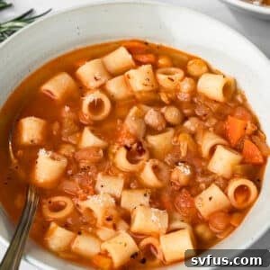 side view of a bowl of pasta e ceci.