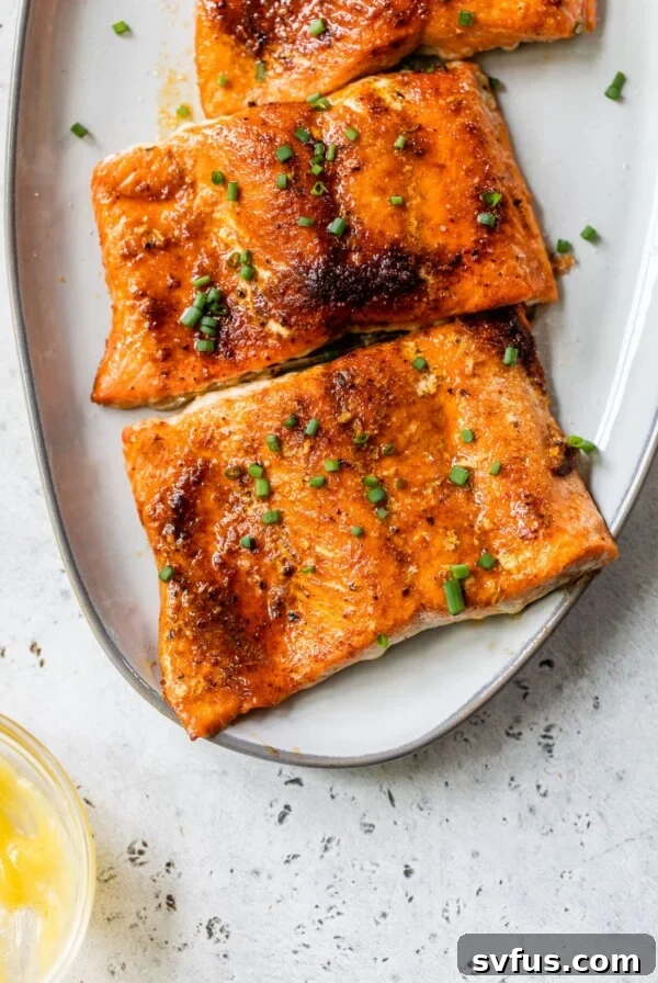 salmon fillets on a platter sprinkled with chives