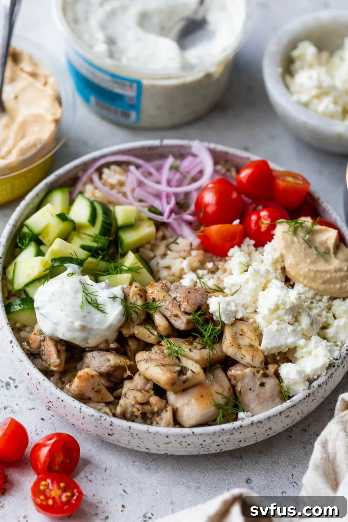side view of an assembled Mediterranean Chicken Bowl.