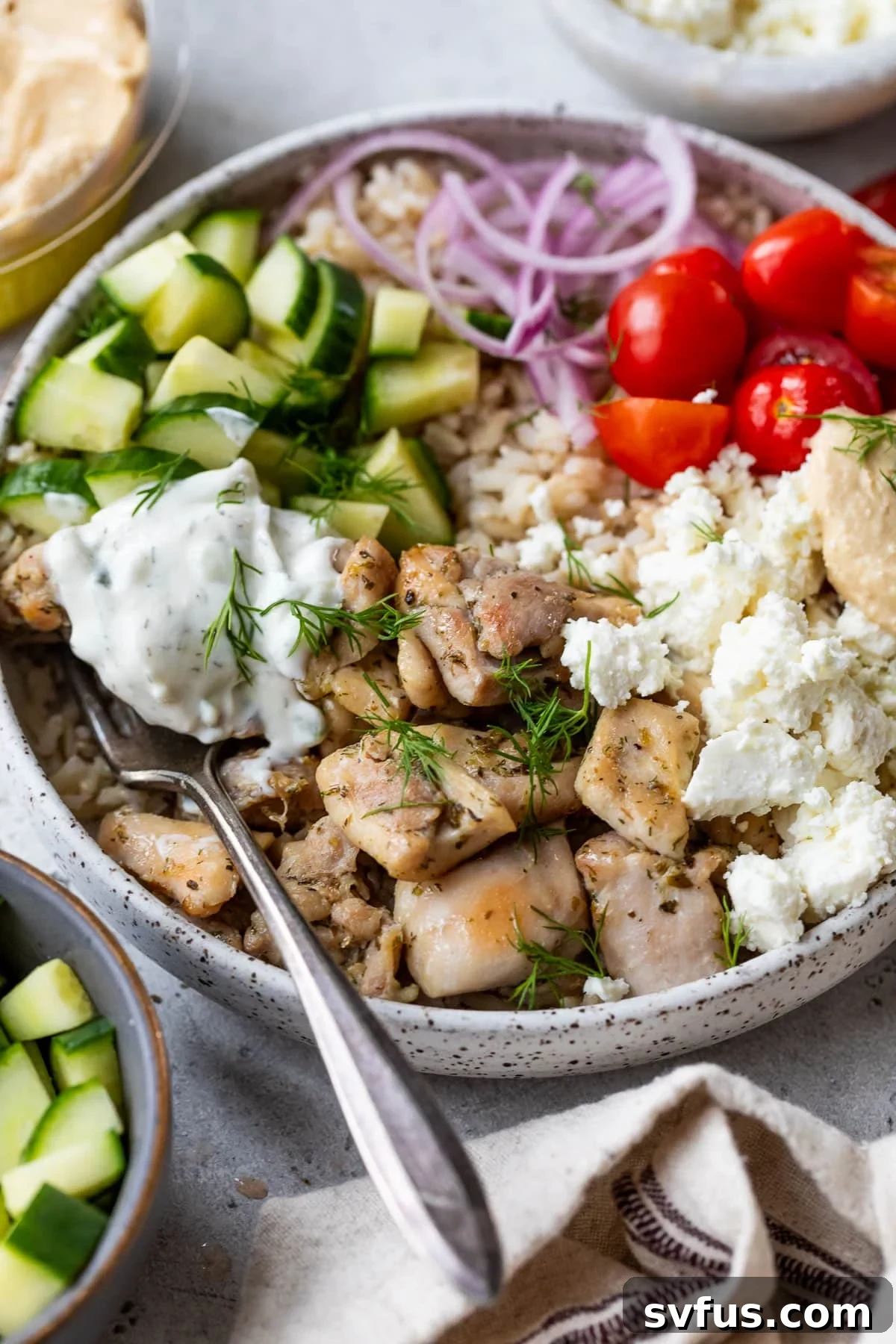 side view of an assembled Mediterranean Chicken Bowl.